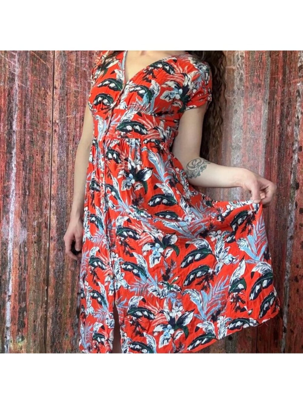 Orange and blue tropical print dress with front buttoned closure